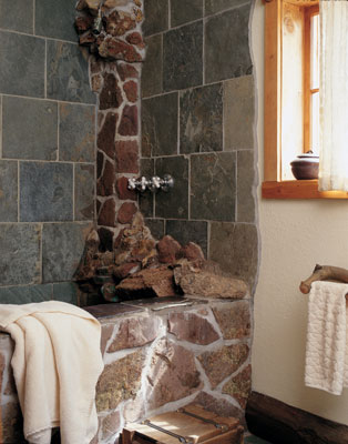 In this sensual bathroom at Gold Lake Resort in Colorado, slate and stone connect bathers with the earth and evoke a warm, nurturing feeling.